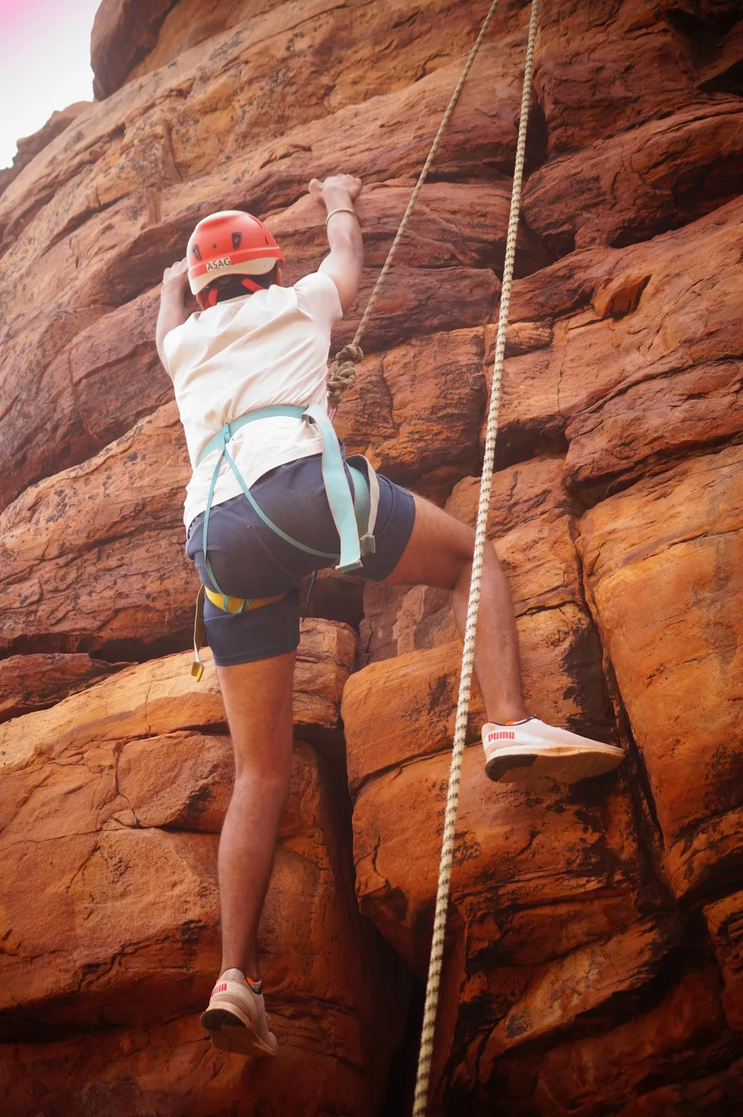 A Sacred Heart student rock climbing at the Gandikota endurance camp