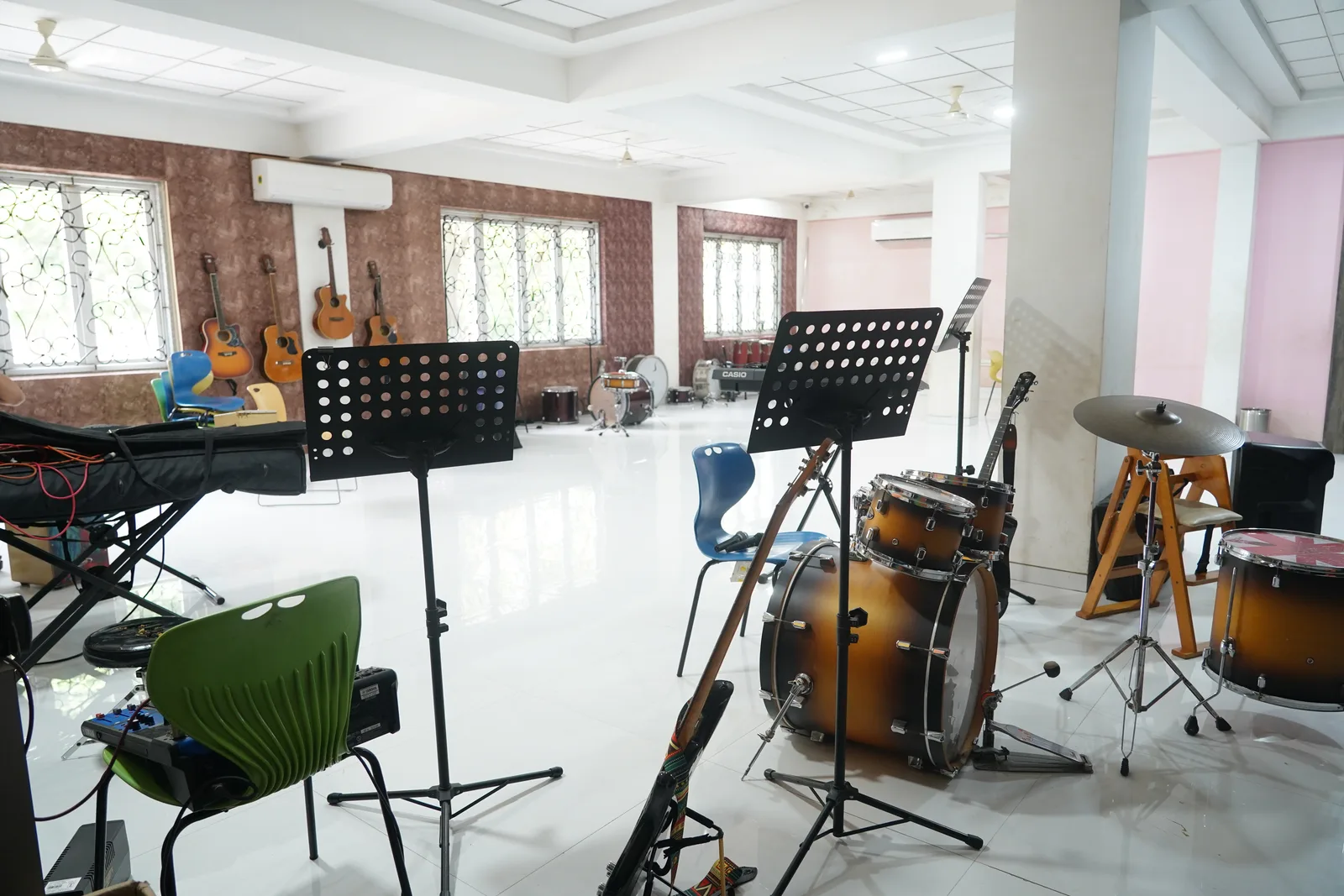 The music room with instruments and a drum kit