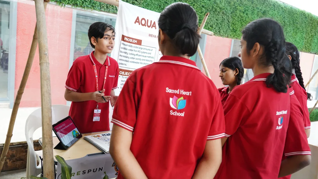 Students at an ISAC exhibit booth