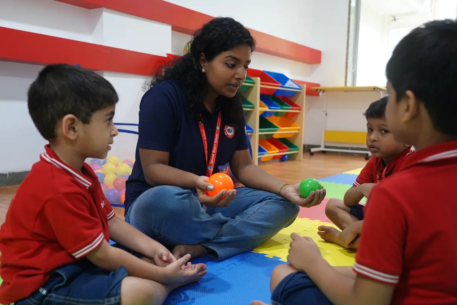 A counsellor engaging students in a therapeutic play activity