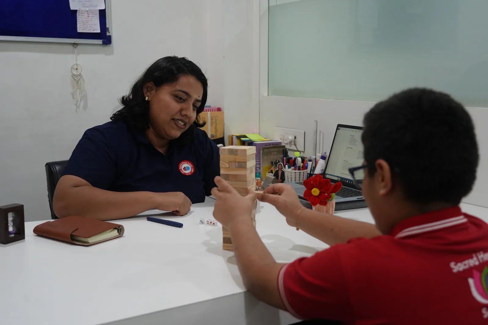 A counsellor playing a game with a student during a session