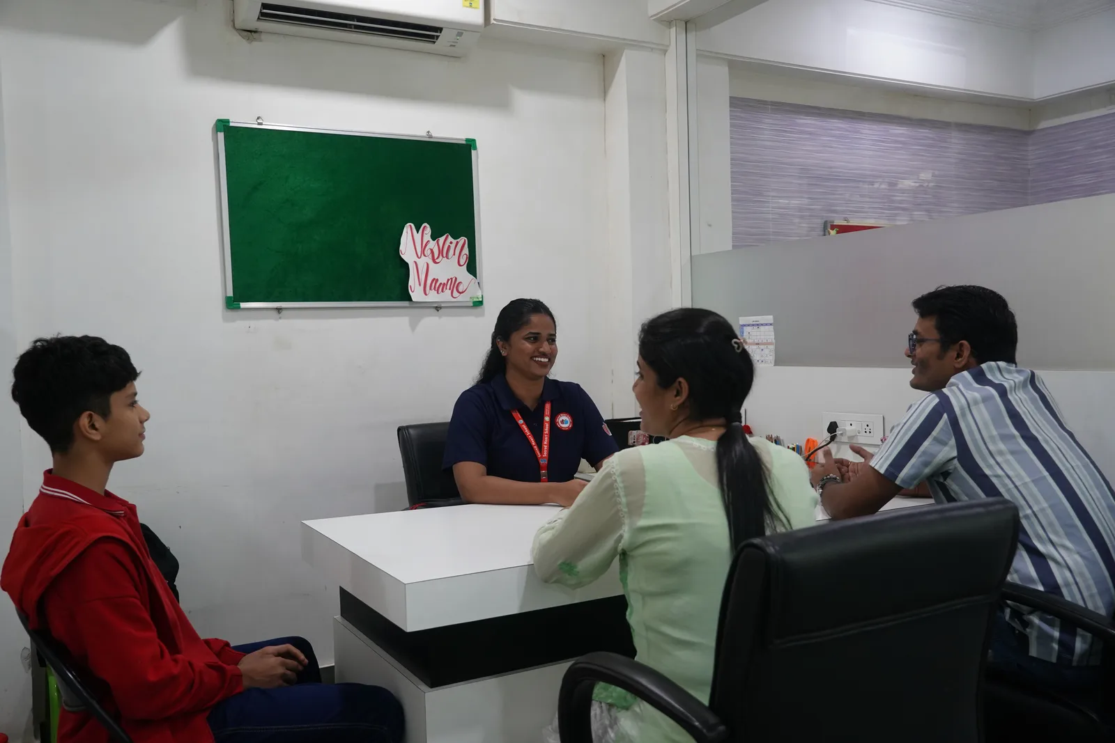 A parent-teacher-student meeting with the school counsellor