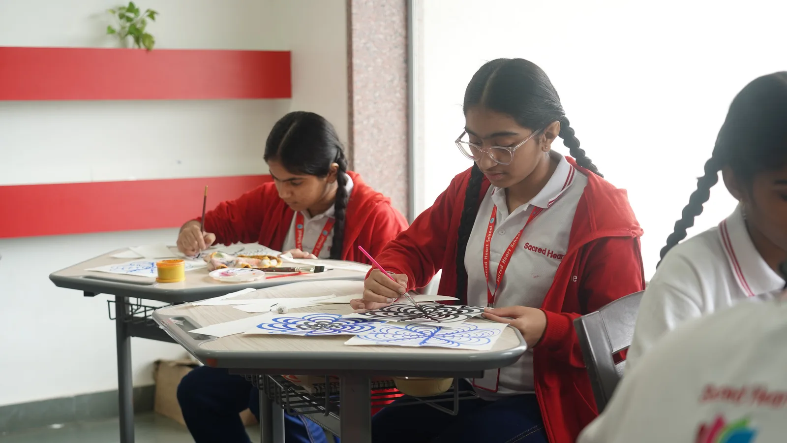 Students painting during an art class