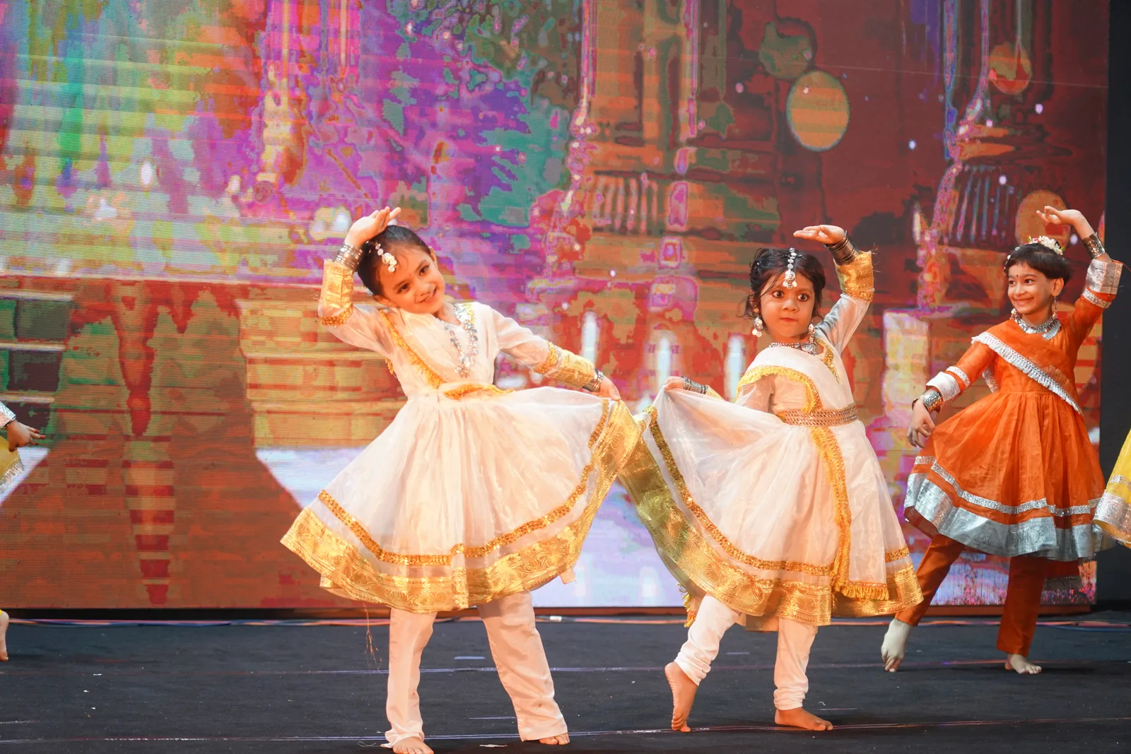 Two Pre-Primary children in traditional dance costumes on stage