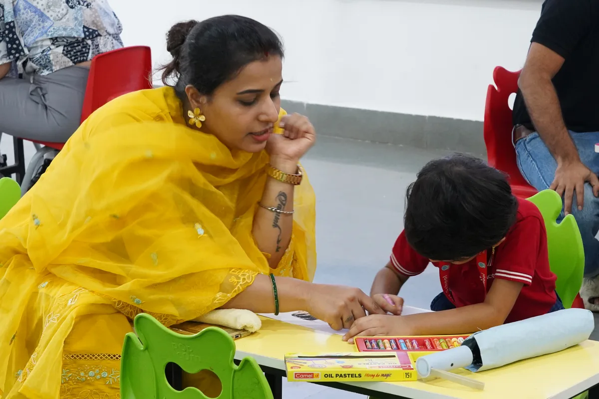A parent helping a child with a hands-on activity