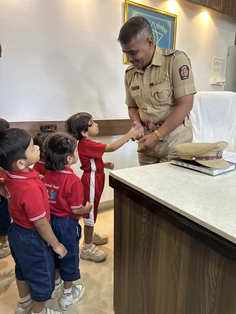 Pre-Primary children meeting a police officer at a police station