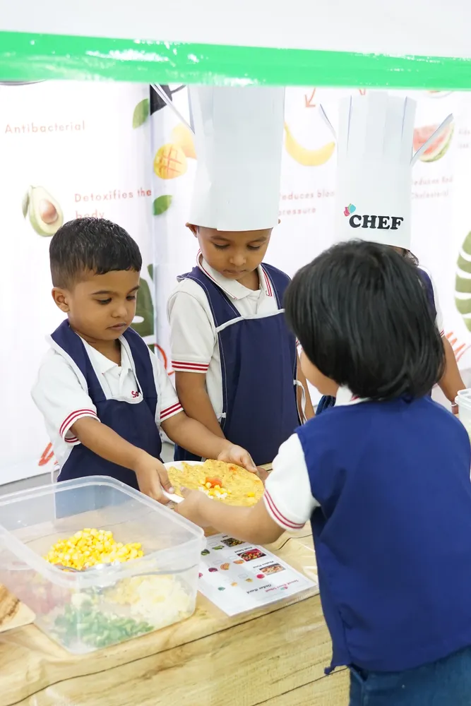 Children serving at a recreated restaurant counter