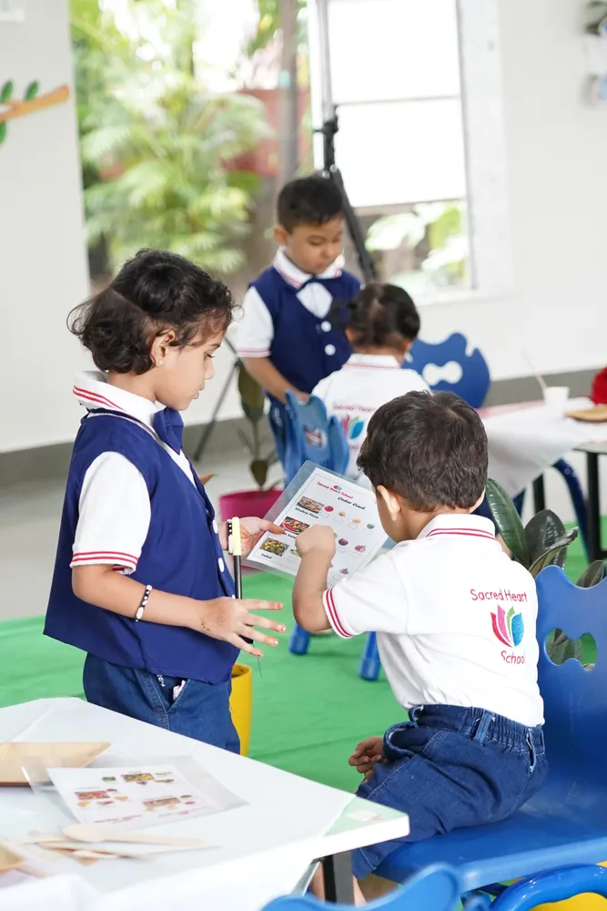 Children role-playing at a recreated restaurant table