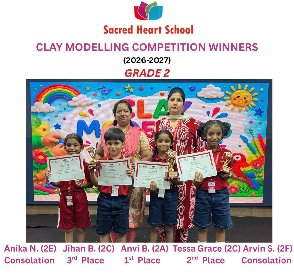 Grade 2 winners of the Clay Modelling Competition holding their certificates