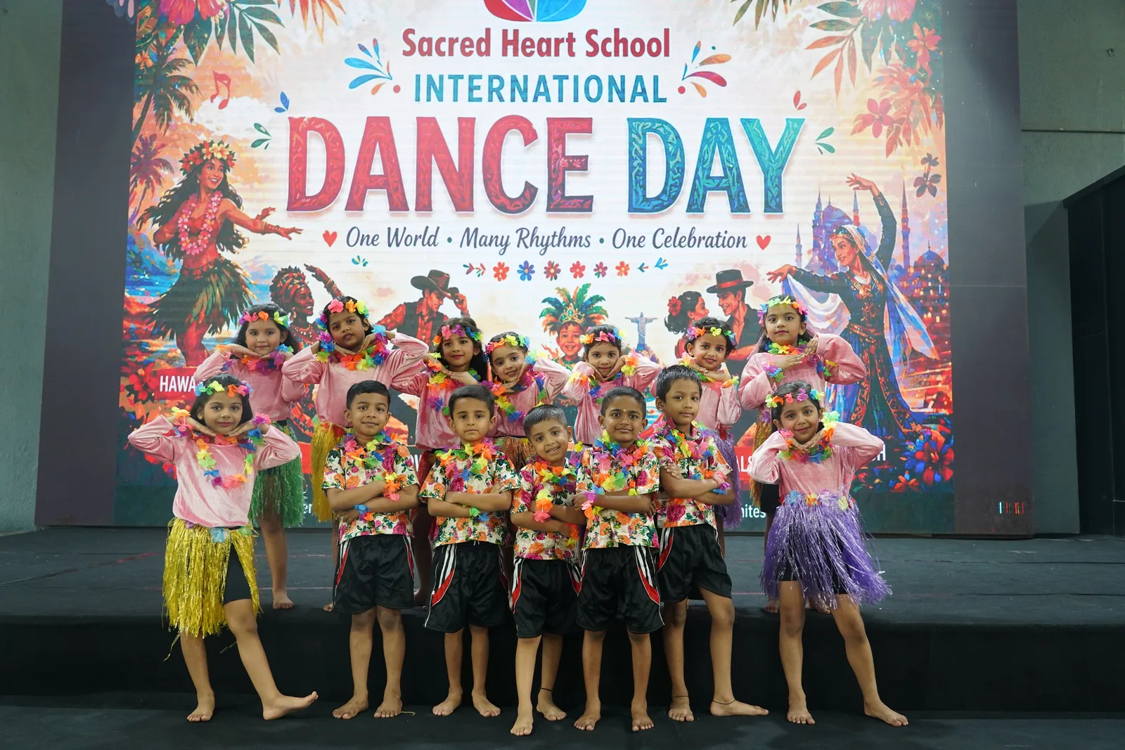 Primary students performing a Hawaiian-style dance on stage