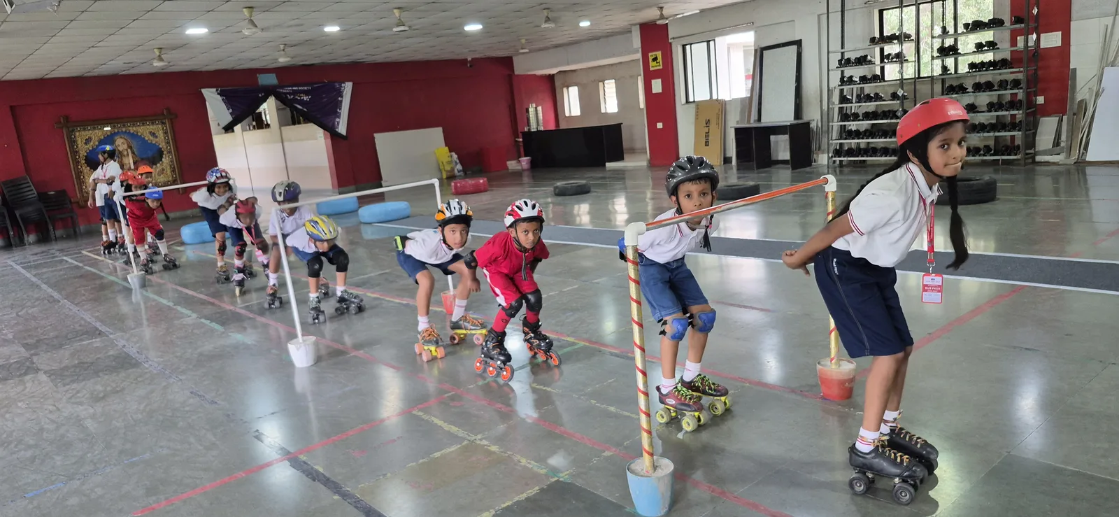 Primary students skating on the indoor rink