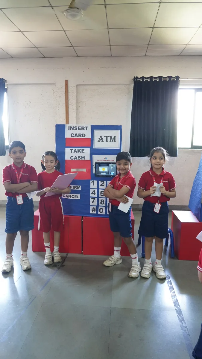 Primary students queueing at the mock bank