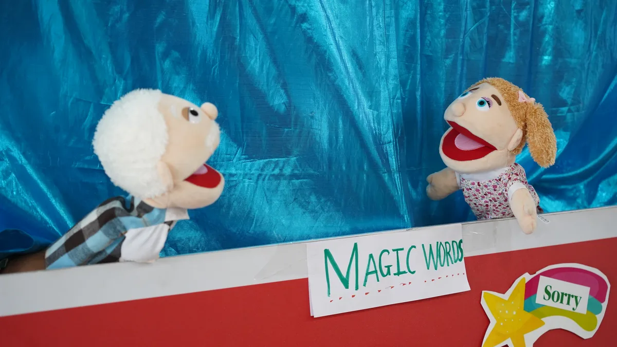 Puppets on the Magic Words puppet stage