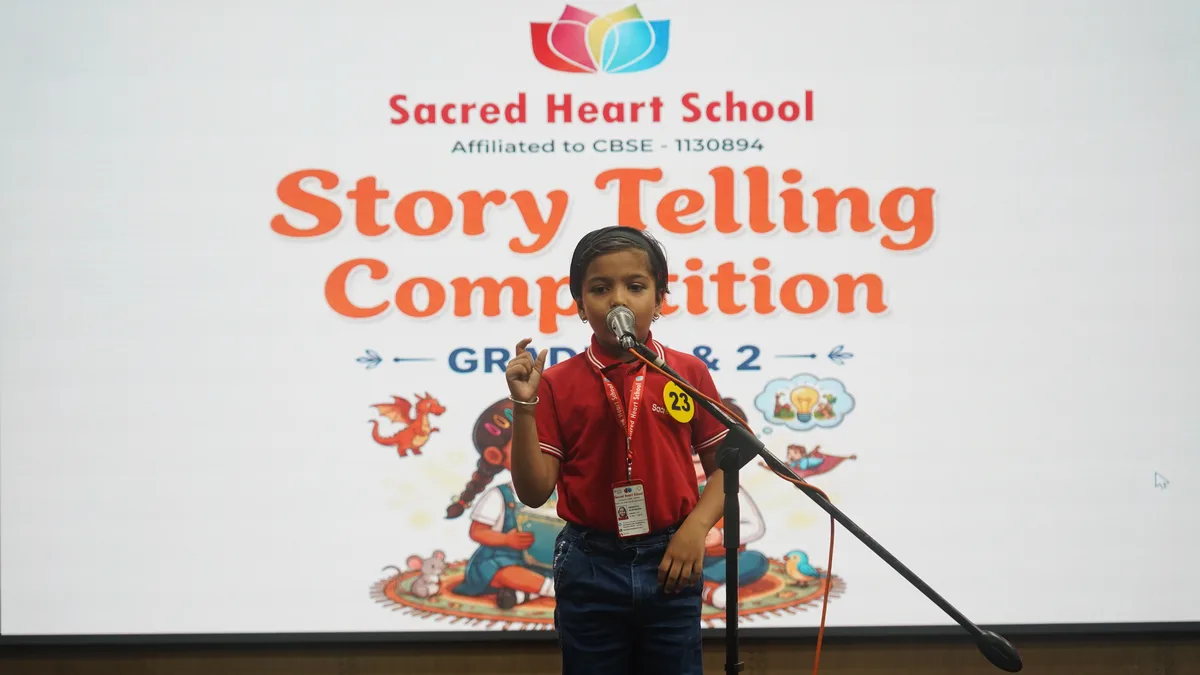 A Primary student performing with expressive gestures at the Story Telling Competition