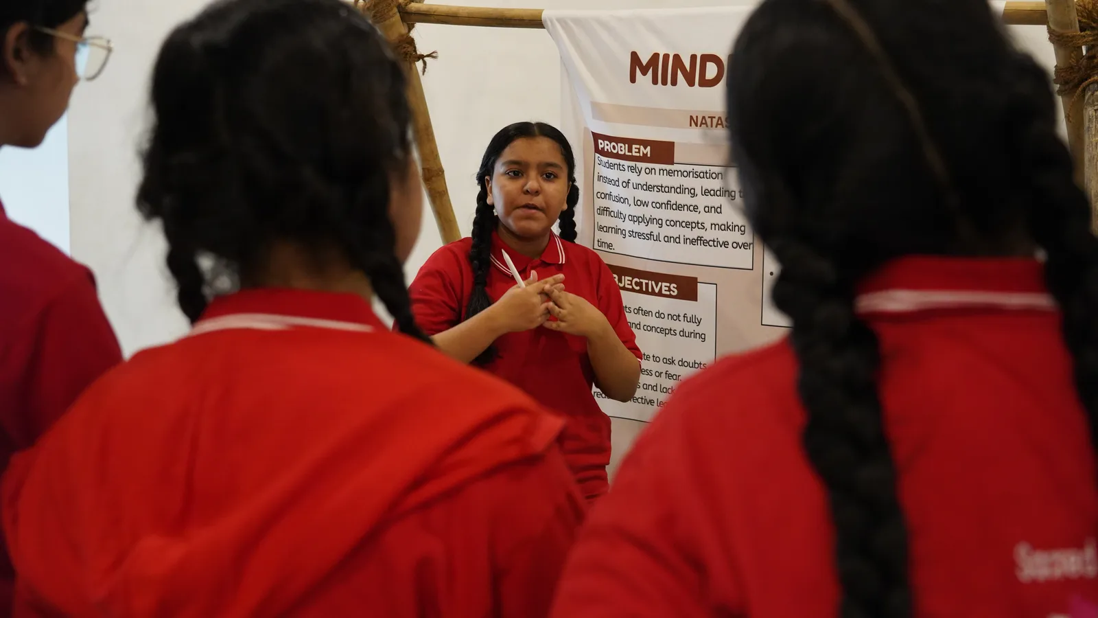 A student presenting her ISAC research project