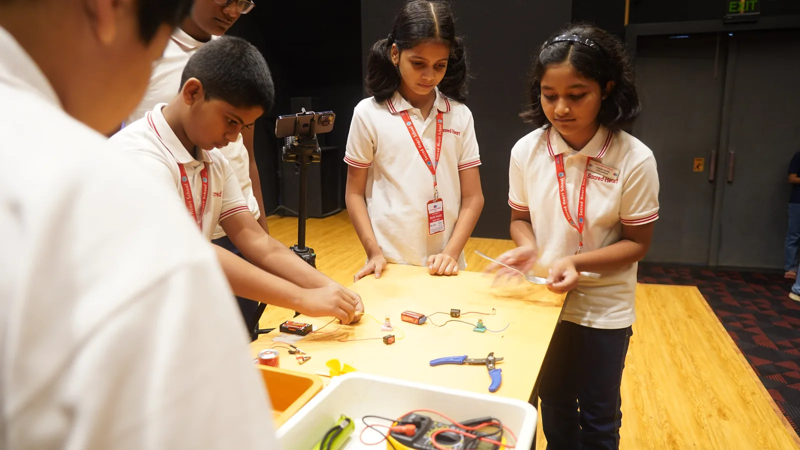 Students building circuits during a robotics workshop
