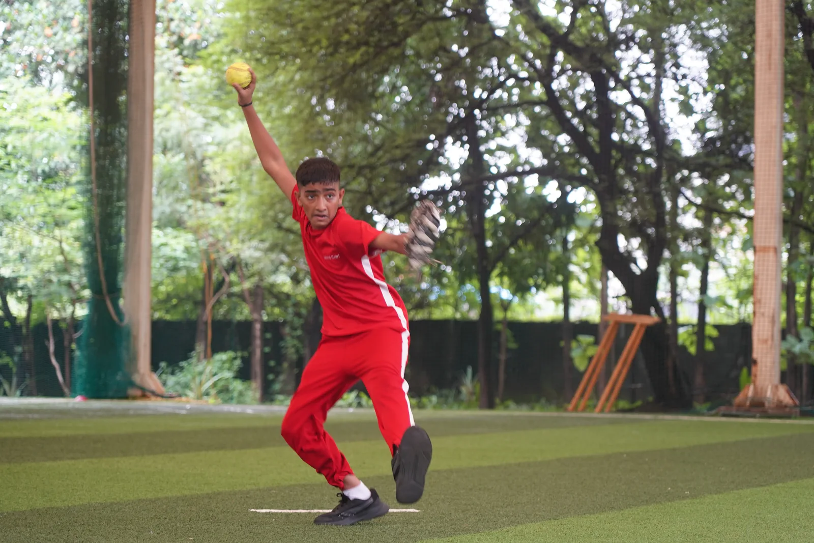 A student bowling during cricket practice
